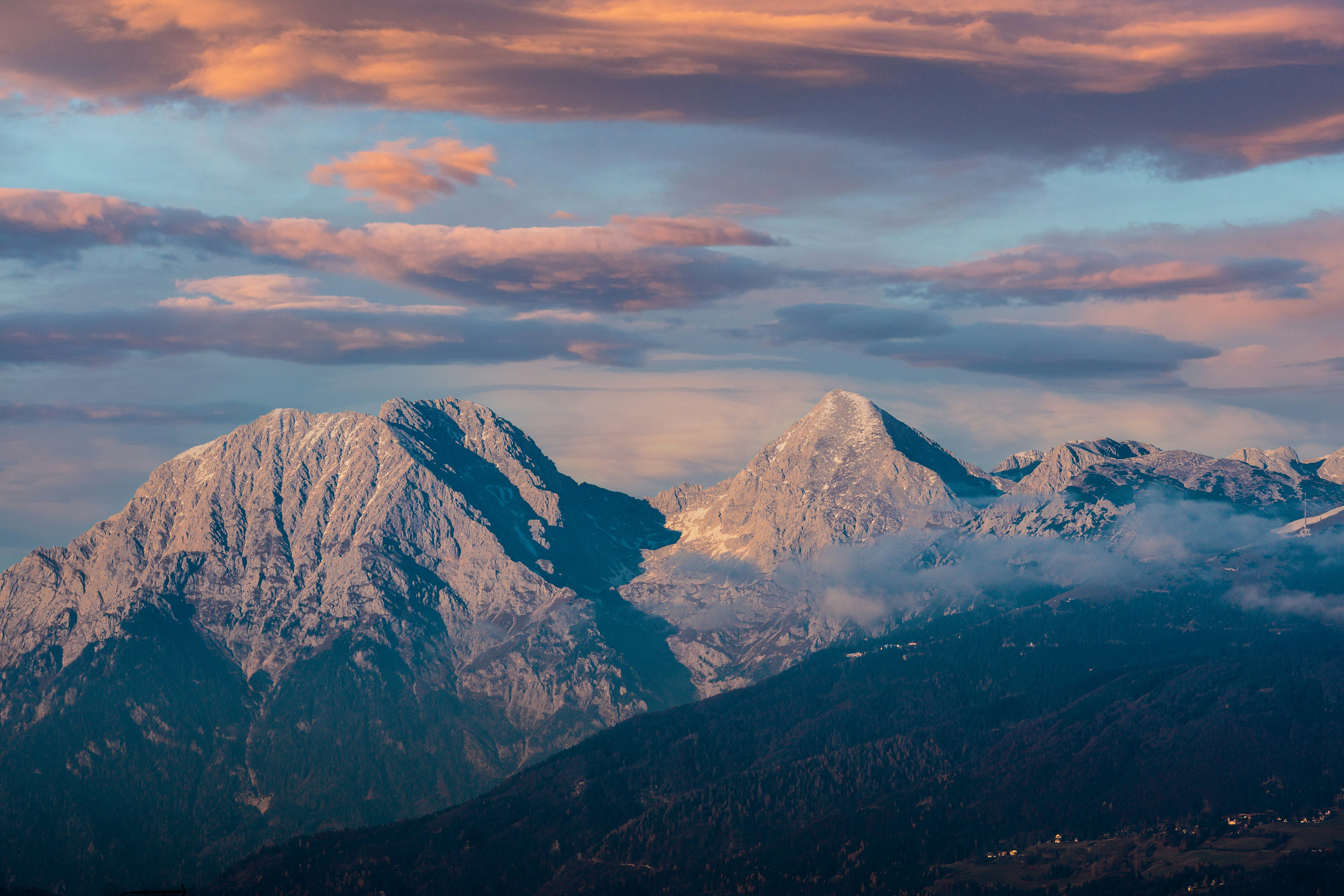 snow covered mountain under cloudy sky during daytime